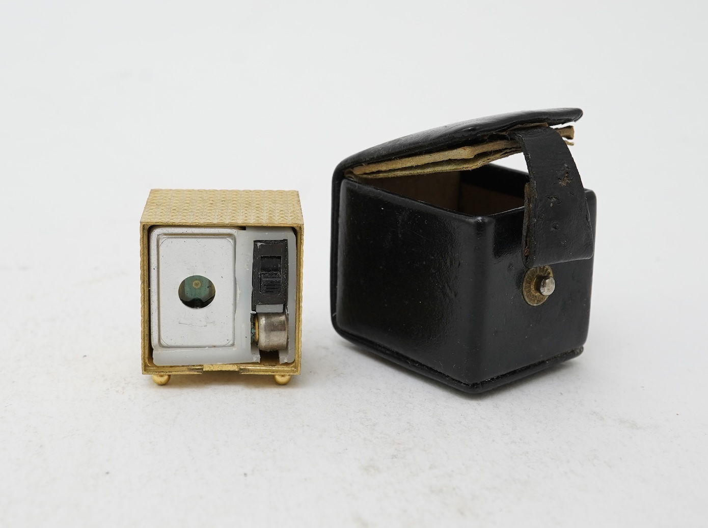 A collection of jewels and accessories including a Russian icon, comprising: a white glass bead rosary; a gilt metal and paste sacred heart motif for wall mounting, length 15.5cm; a gilt metal cube-shaped Nepro alarm clo